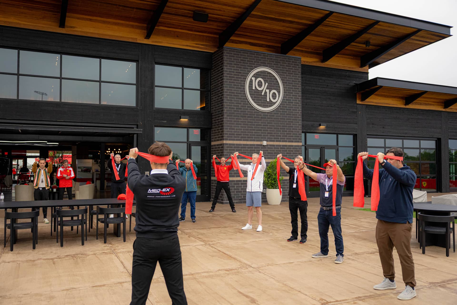 Physical warm-up session in front of Ten Tenths clubhouse