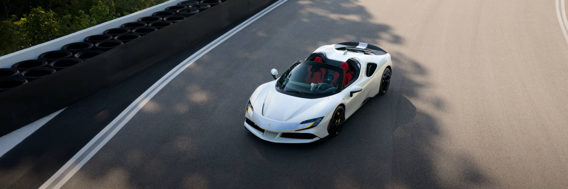 Aerial view of a white Ferrari on a racing track
