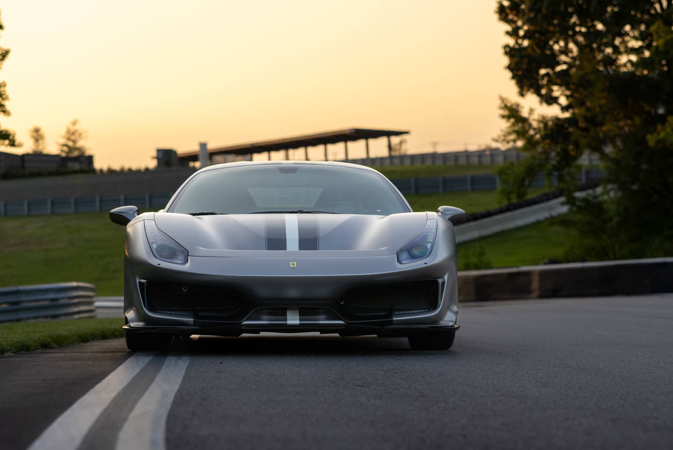 Front view of a Ferrari on a racing track
