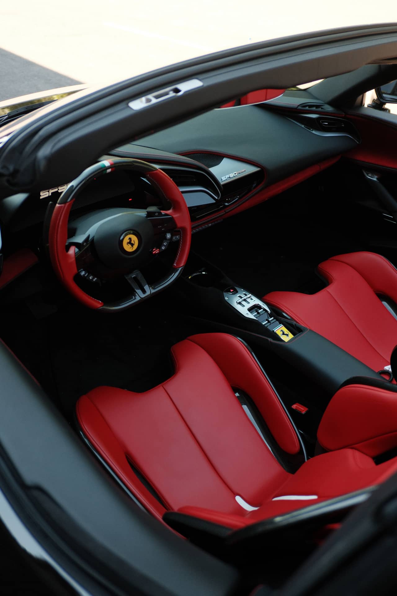 Angled view of a red and black Ferrari interior